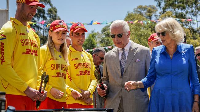 Charles and Camilla cook sausages in Parramatta. Picture: AFP