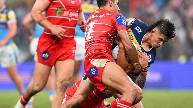 Jayden Campbell of the Titans is tackled during the round 10 NRL match between the Gold Coast Titans and the St George Illawarra Dragons at Suncorp Stadium, on May 14, 2022, in Brisbane, Australia. (Photo by Bradley Kanaris/Getty Images)