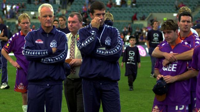 Perth Glory coach Bernd Stange, left, and team members after his side lost in a penalty shootout to Wollongong Wolves in the 2000 NSL grand final. Picture: Ian Cugley