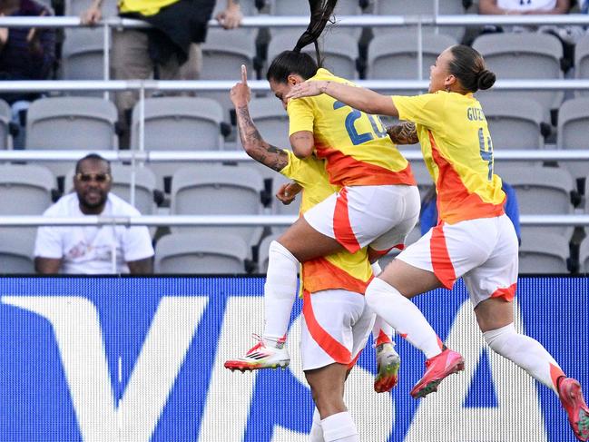 SAN DIEGO, CALIFORNIA - FEBRUARY 26: Marcela Restrepo #8 of Columbia, Sara Sofia Restrepo #20 of Columbia and Ana GuzmÃ¡n #4 of Columbia celebrate a goal during the first half against Australia during the 2025 SheBelieves Cup match between Australia and Colombia at Snapdragon Stadium on February 26, 2025 in San Diego, California.   Orlando Ramirez/Getty Images/AFP (Photo by Orlando Ramirez / GETTY IMAGES NORTH AMERICA / Getty Images via AFP)