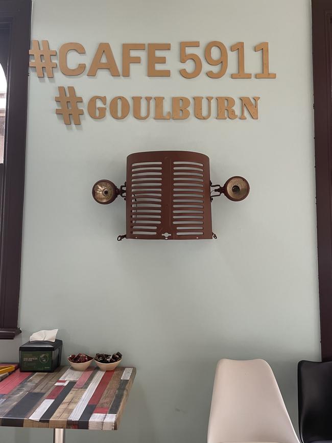 The front of a tractor bought at a Goulburn auction sits on a wall in the cafe, as a tribute to the owner’s father and Goulburn itself. Picture: Niki Iliagoueva