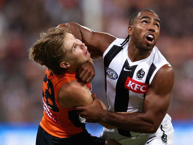 Harvey Thomas of the Giants and Isaac Quaynor of the Magpies contest for the ball during the AFL Opening Round in March. Picture: Cameron Spencer/Getty Images.