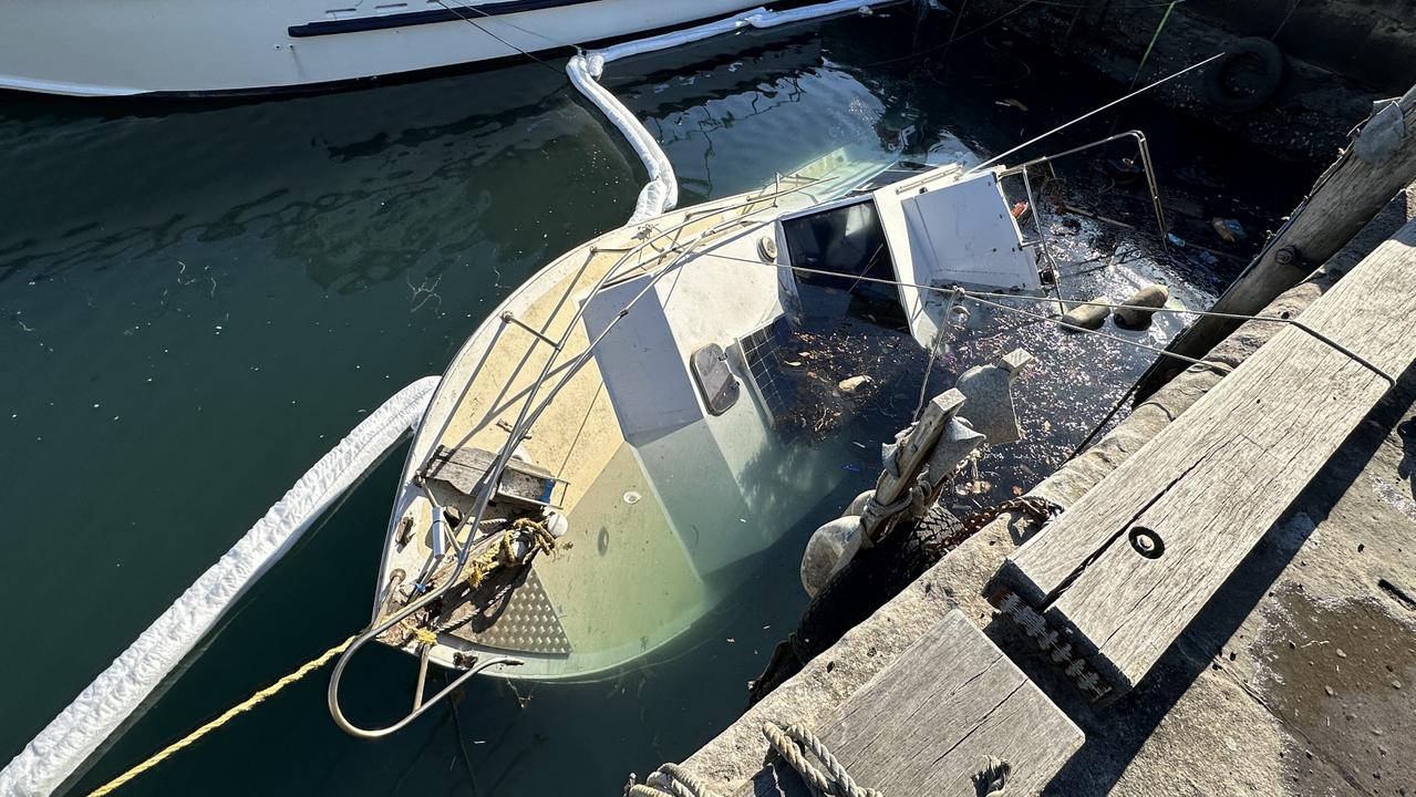 Booms have been placed around the boat to prevent further diesel spillage. Picture: Dylan Arvela