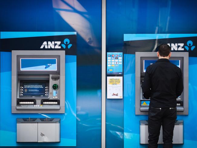 A customer uses an automated teller machine (ATM) outside an Australia & New Zealand Banking Group Ltd. (ANZ) branch in Sydney, Australia, on Wednesday, Aug. 31, 2011. Australia & New Zealand Banking Group Ltd. is considering buying Japan's Aozora Bank Ltd. as part of a plan to expand in Asia and broaden its funding sources, according to a person familiar with the matter. Photographer: Ian Waldie/Bloomberg