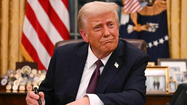 US President Donald Trump signs executive orders in the Oval Office of the White House in Washington, DC, on January 20, 2025. Picture: NewsWire / Jim WATSON / POOL / AFP