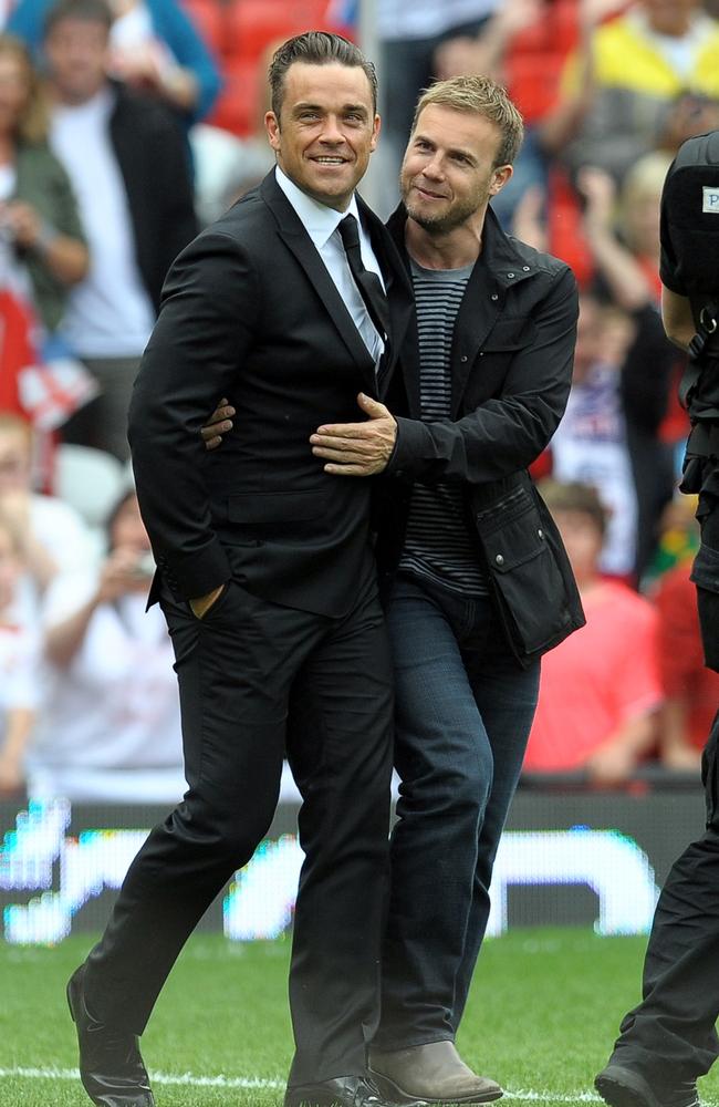 Robbie Williams reunited with his Take That band mates for new music and a tour in 2010. Picture: AFP