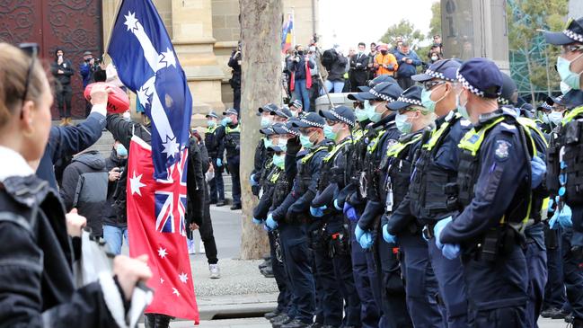 Police set up a barricade with officers and cars. Picture: Matrix