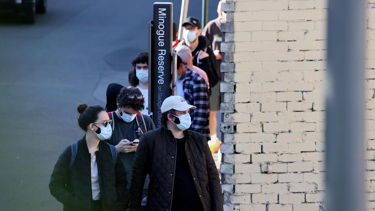 People wait in a 1.5 hour single file line at the Glebe Vaccination hub in Sydney on Tuesday. Picture: NCA NewsWire/Dylan Coker