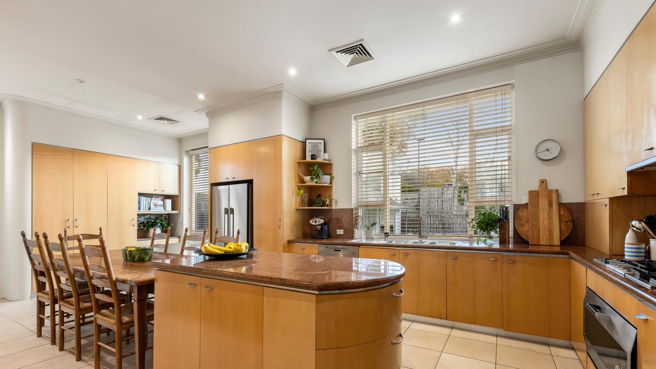 The kitchen features European appliances, granite benchtops and plenty of storage space.