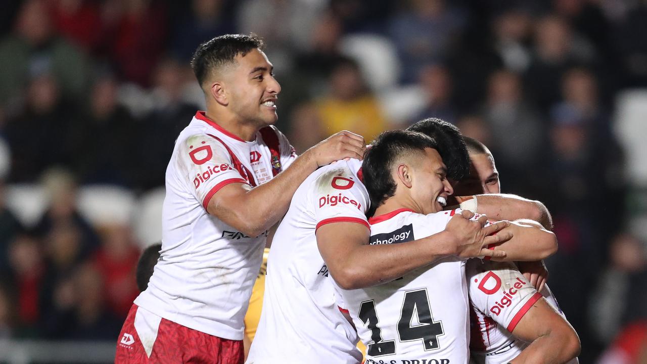 ST HELENS, ENGLAND – OCTOBER 18: Isaiya Katoa of Tonga celebrates their sides third try with team mates during Rugby League World Cup 2021 Pool D match between Tonga and Papua New Guinea at Totally Wicked Stadium on October 18, 2022 in St Helens, England. (Photo by Charlotte Tattersall/Getty Images for RLWC)