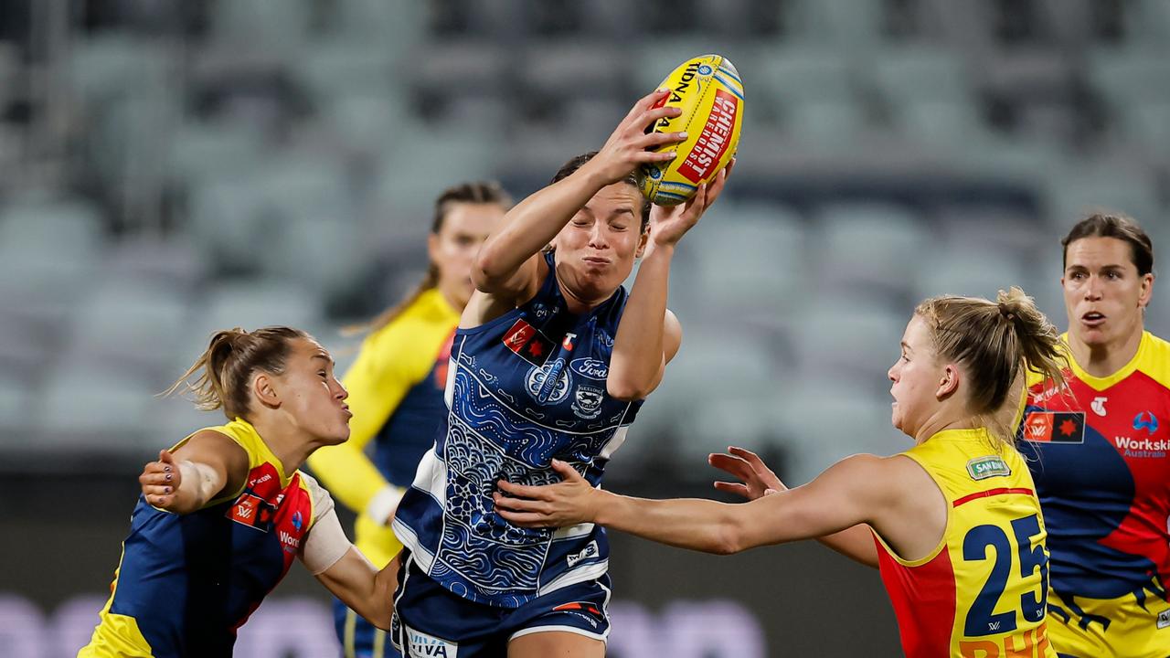 Geelong defender Anna-Rose Kennedy tries to evade Adelaide duo Hannah Munyard and Teah Charlton. Picture: Dylan Burns/AFL Photos via Getty Images