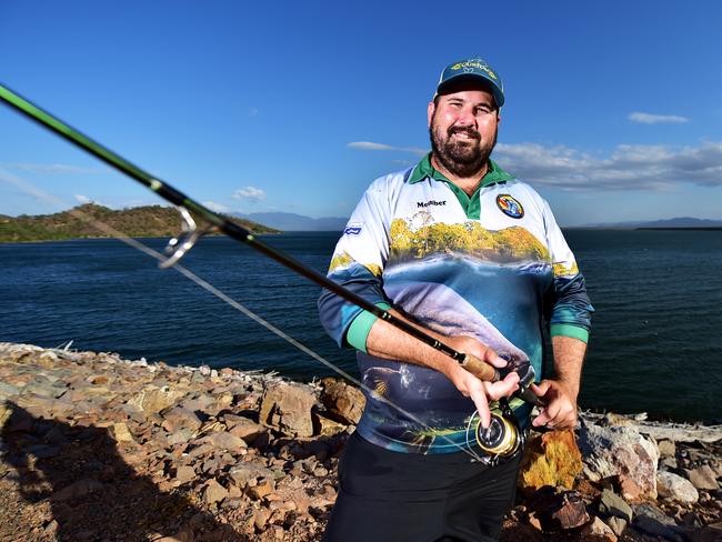 President of the Townsville Barramundi Stocking Society Rhyce Bullimore with his son Parker 2 on the Ross River Dam. Picture: Alix Sweeney