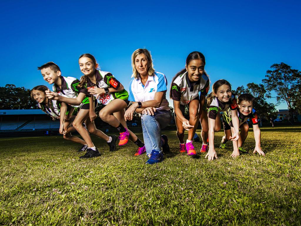 Glynis Nunn with Ashmore Little Athletics kids. Picture: NIGEL HALLETT