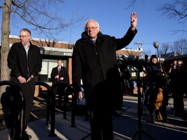 Democratic presidential candidate Senator Bernie Sanders waves as he leaves a news conference after voting in the Vermont primary.