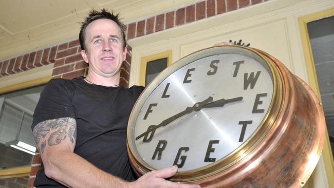 Jeweller David Collins renovated the clock outside the the Bangalow Post Office in 2011. Picture: The Northern Star archive