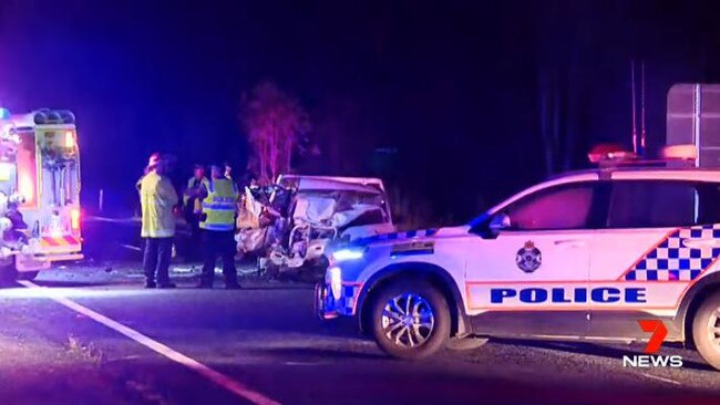 Emergency service workers at the scene of Saturday's double fatality on the Bruce Highway at Kolonga.