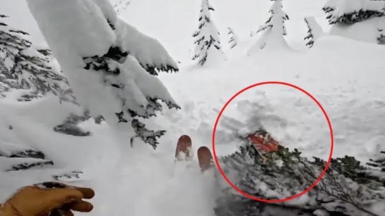 Dramatic rescue of snowboarder buried headfirst in snow caught on video