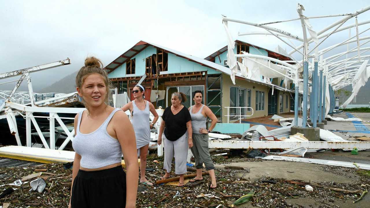 BLOWN APART: Airlie Beach residents Maika McDonald,15, Lauren Squires, Karen Gordon, and Katelin Gordon, survey the damage at Shute Harbour after cyclone Debbie. Picture: Liam Kidston