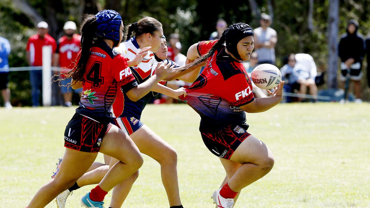 Action from 16 Girls Tonga v Philippines. Harmony Nines Rugby League. Picture: John Appleyard