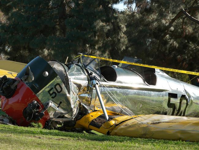 Managed to get out alive ... The World War II-era plane owned by Harrison Ford is seen after crashing at the Penmar Golf Course in Venice, Los Angeles. Picture: AFP / Jonathan Alcorn