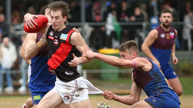 NFL: Eltham’s Aidan Biddle can’t break multiple tackles. Picture: Hamish Blair