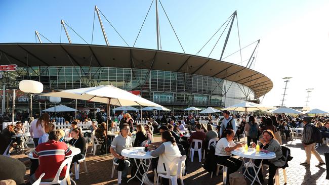 Hillsong Church holds a week long convention at Acer Arena in Olympic Park. Attendees gather outside during breaks from the activities.