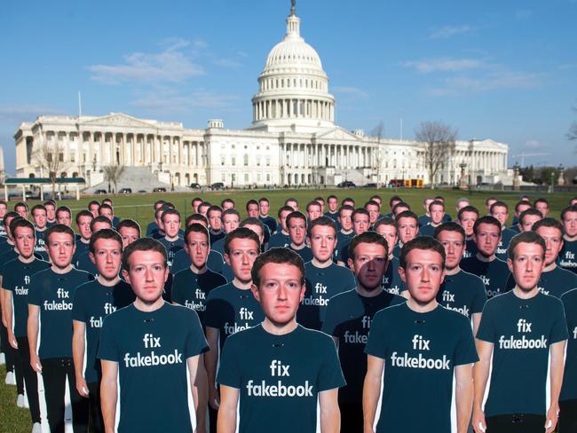 One hundred cardboard cutouts of Facebook founder and CEO Mark Zuckerberg stand outside the US Capitol in Washington, DC to raise awareness of fake accounts spreading disinformation on Facebook. Picture: AFP