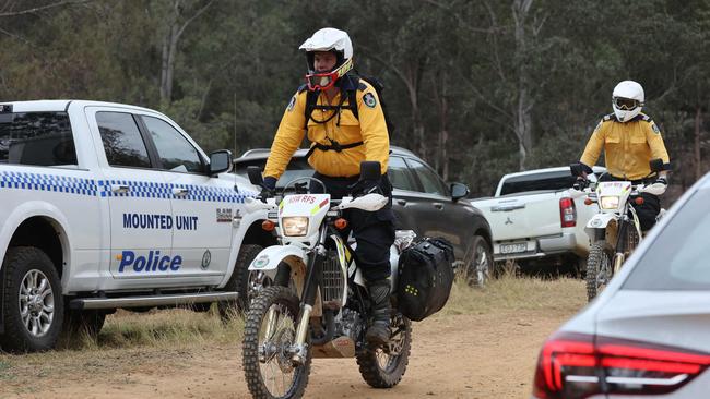 Searchers on trail bikes. Picture: David Swift