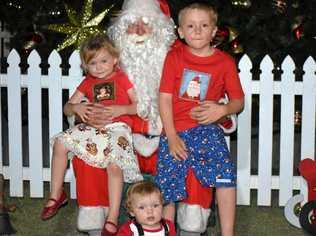 FESTIVE CHEER: Faith, Jimmy and Connor Edmonds enjoyed the visit from Santa. Picture: Marissa Newman