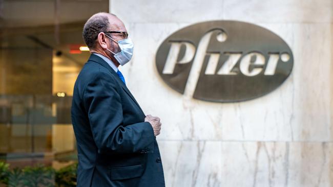 A man walks by the Pfizer headquarters in New York City. Picture: Getty Images