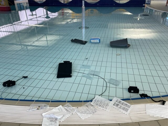 Phones and computer equipment was thrown into the pool. Picture: Supplied.