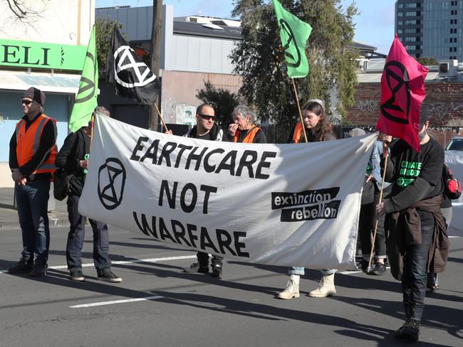 Protesters march down Montague St on Sunday morning. Picture: David Crosling