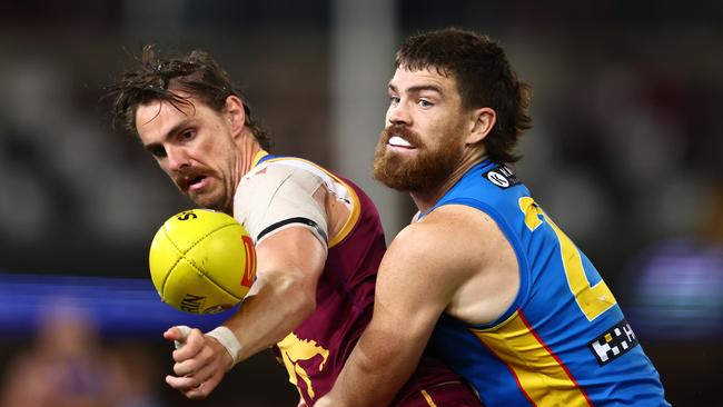 BRISBANE, AUSTRALIA - MAY 05: Joe Daniher of the Lions and Sam Collins of the Suns compete for the ball during the round eight AFL match between Brisbane Lions and Gold Coast Suns at The Gabba, on May 05, 2024, in Brisbane, Australia. (Photo by Chris Hyde/AFL Photos/via Getty Images )