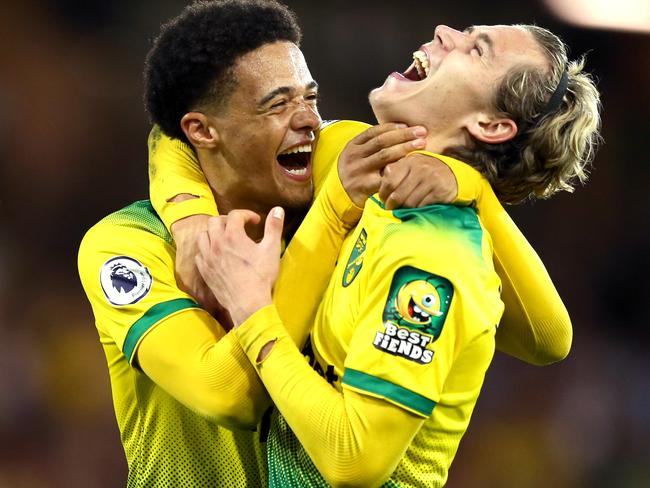 NORWICH, ENGLAND - SEPTEMBER 14: Todd Cantwell and Jamal Lewis of Norwich City celebrate following their sides victory in  during the Premier League match between Norwich City and Manchester City at Carrow Road on September 14, 2019 in Norwich, United Kingdom. (Photo by Paul Harding/Getty Images)