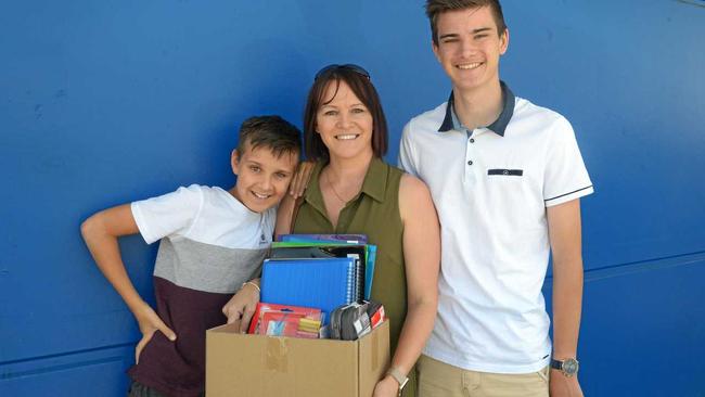 Jack, Jo and Tom Kavanagh join the crowds at Officeworks in preparation for a new school year. Picture: Jann Houley