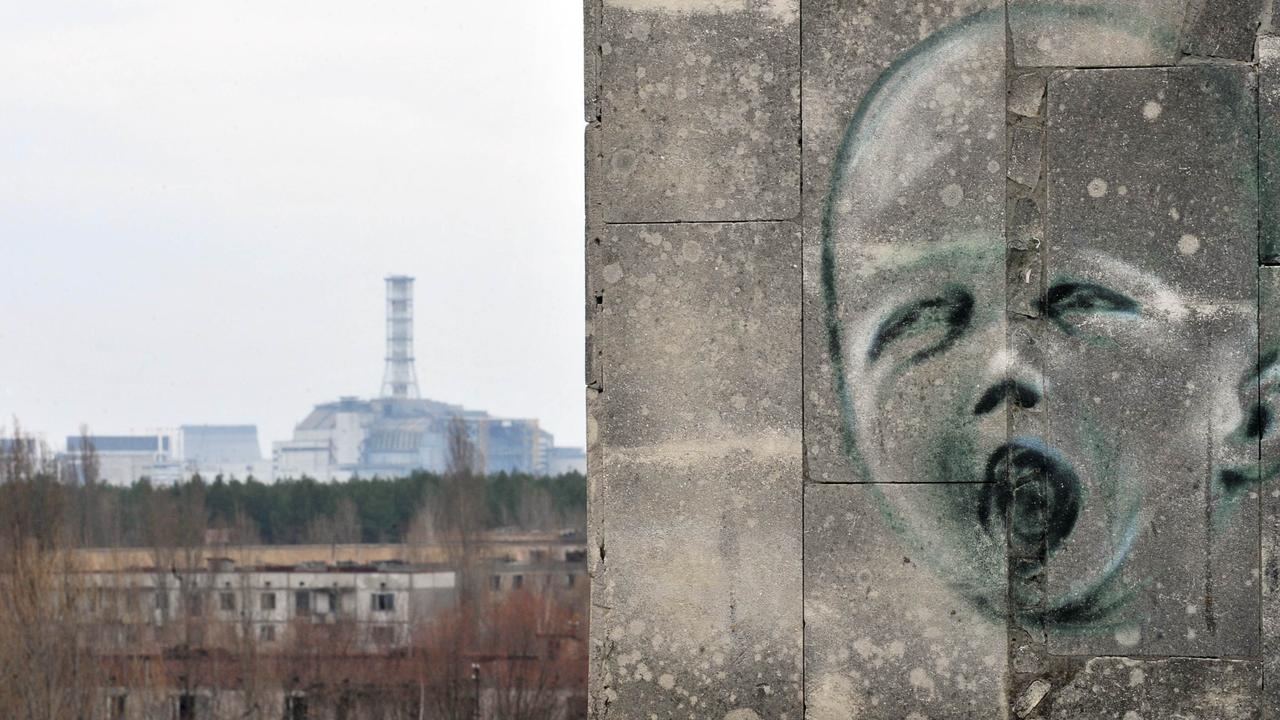 The former Chernobyl Nuclear power plant seen from Pripyat. AFP PHOTO / SERGEI SUPINSKY