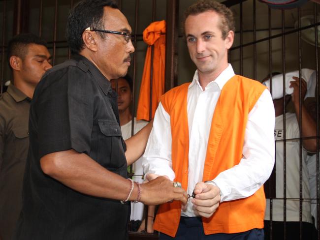 David Taylor is escorted to the Denpasar District Court in Bali. Picture: Lukman S. Bintoro