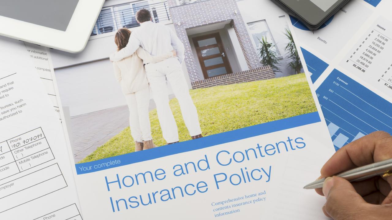 Home and contents insurance document with paperwork and technology. The included model released image can also be found in my portfolio. Image  #26822047