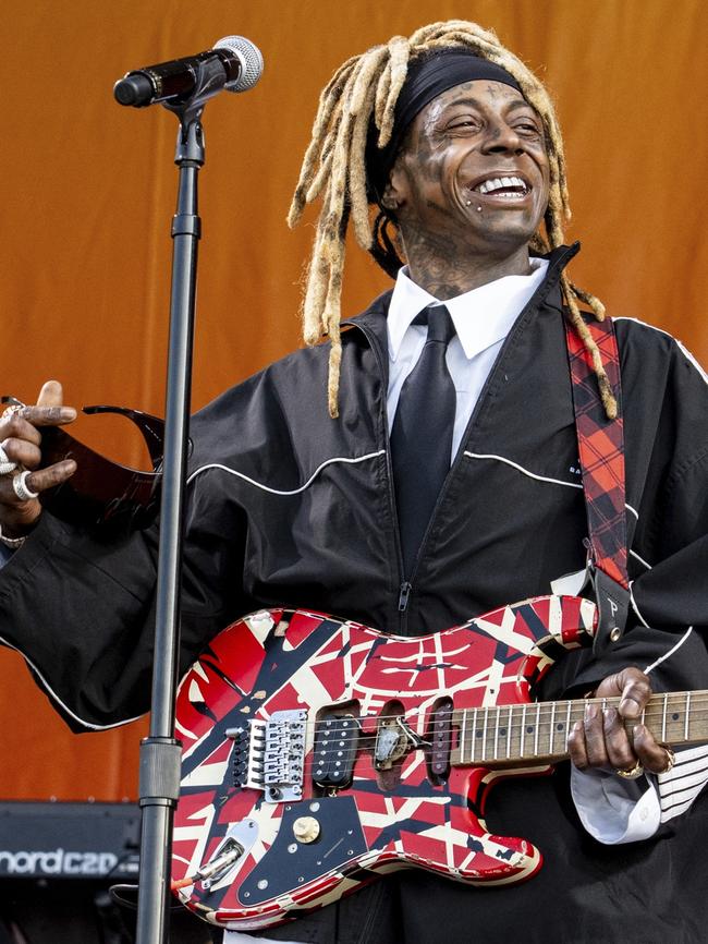 Lil Wayne performs with The Roots.