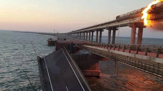 A fire sparked by a car bomb that has broken out on a key bridge linking Crimea to Russia, near Kerch, on October 8, 2022. Picture: AFP