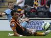 Manchester City's Edin Dzeko, rear, beats Hull City's Liam Rosenior to score his side's third goal during their English Premier League match at the KC Stadium, Hull England Saturday Sept. 27, 2014. (AP Photo/Anna Gowthorpe/PA) UNITED KINGDOM OUT NO SALES NO ARCHIVE