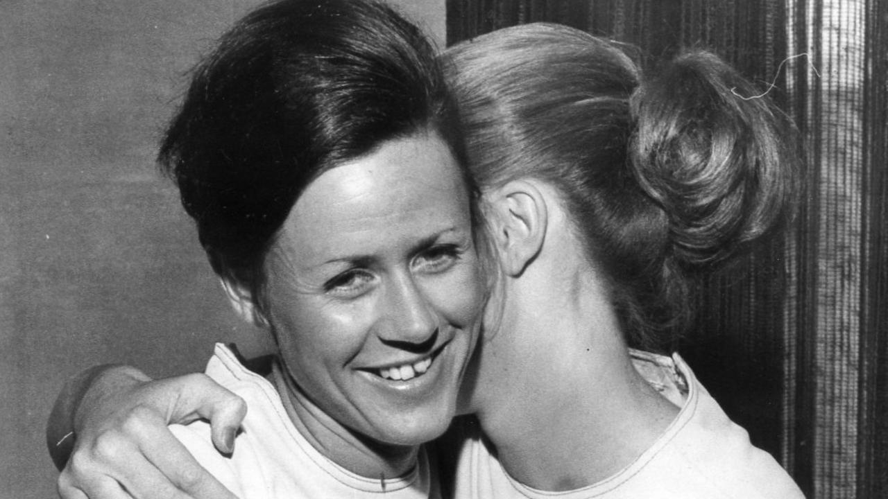 Kaye Goreham, left, and Gai Rennie hug each other in Ansett's airport VIP lounge. Picture: File