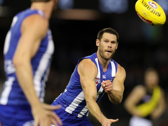 Sam Gibson fires out a handball while playing for North Melbourne against Richmond in June, 2017. Picture: Michael Klein