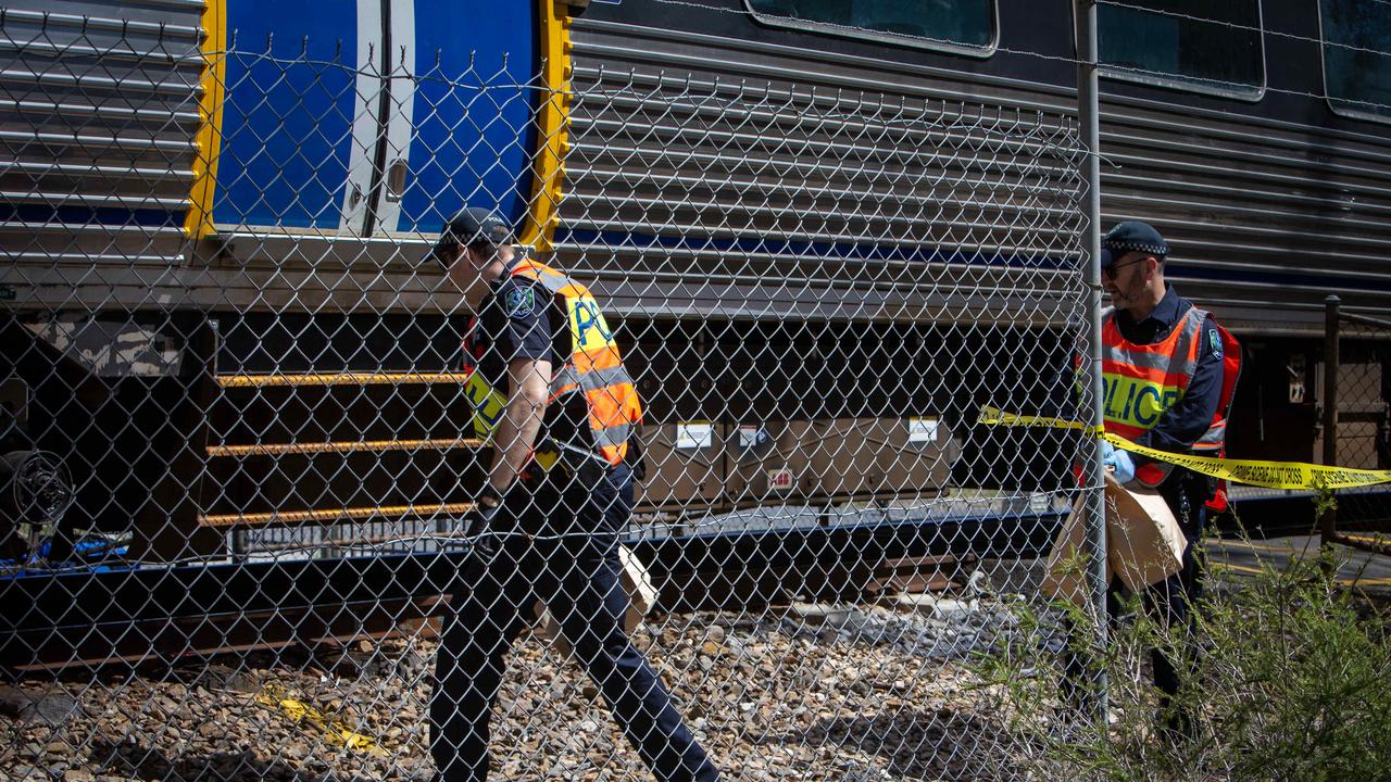 Authorities tape off the scene at the Grange crossing where a woman was hit on Wednesday. Picture: Emma Brasier