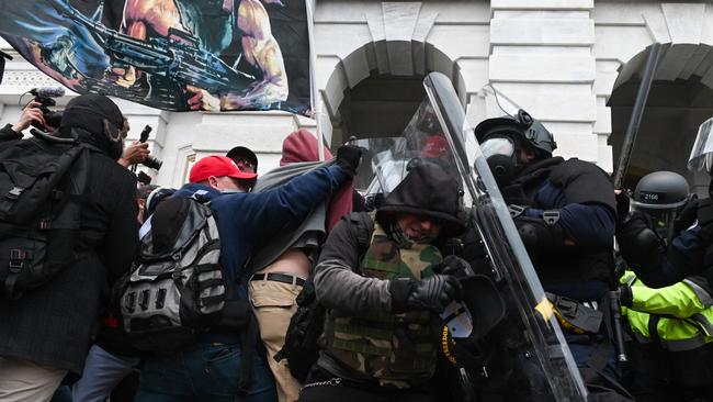 Riot police engage Trump supporters as they storm the US Capitol Building on January 6. Picture: AFP