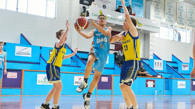 Kyzen Luki from Cairns Marlins makes a shot against Townsville Heat Picture: Romy Bullerjahn