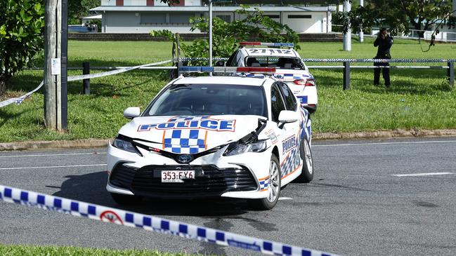 Police officers attend the scene of a car crash involving a stolen police vehicle. Picture: Brendan Radke