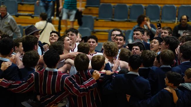 The Southport School First V basketballers celebrating. Pic: Heidi Brinsmead.