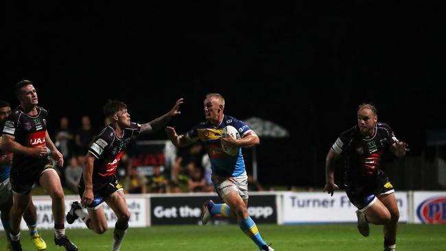 Gold Coast Titans halfback Tanah Boyd evades a Guy Hamilton tackle during a pre-season trial against Burleigh Bears at Pizzey Park. February 20, 2021. Photo Jason O'Brien
