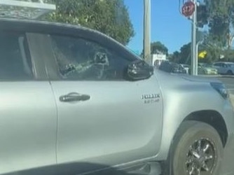 The man returned to his vehicle after smashing the glass. Picture: Channel 9